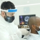 Barber Mo Wearing FULL PPE serving a client at SKILLS Dubai Barbershop